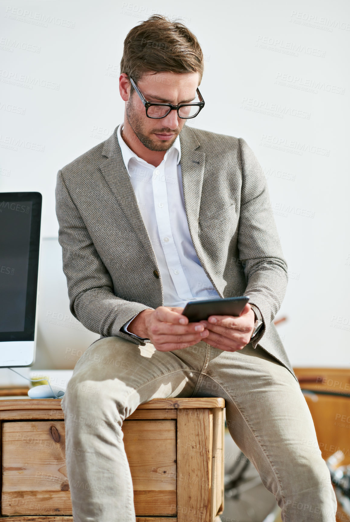 Buy stock photo Office, journalist or business man with tablet for article research, information or news stories online by workspace. Male employee, content writer and glasses for reading, digital updates or connect