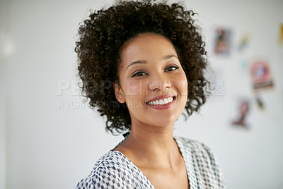 Buy stock photo Portrait of an attractive young businesswoman in the office. The commercial designs displayed represent a simulation of a real product and have been changed or altered enough by our team of retouching and design specialists so don't have copyright infringements