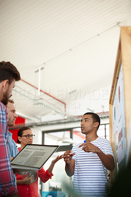 Buy stock photo Shot of a group of designers discussing ideas in a meeting