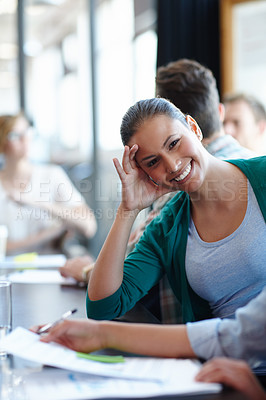Buy stock photo Portrait of a relaxed female designer in a meeting with her colleagues
