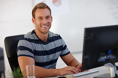 Buy stock photo Portrait of a young male designer working at his computer