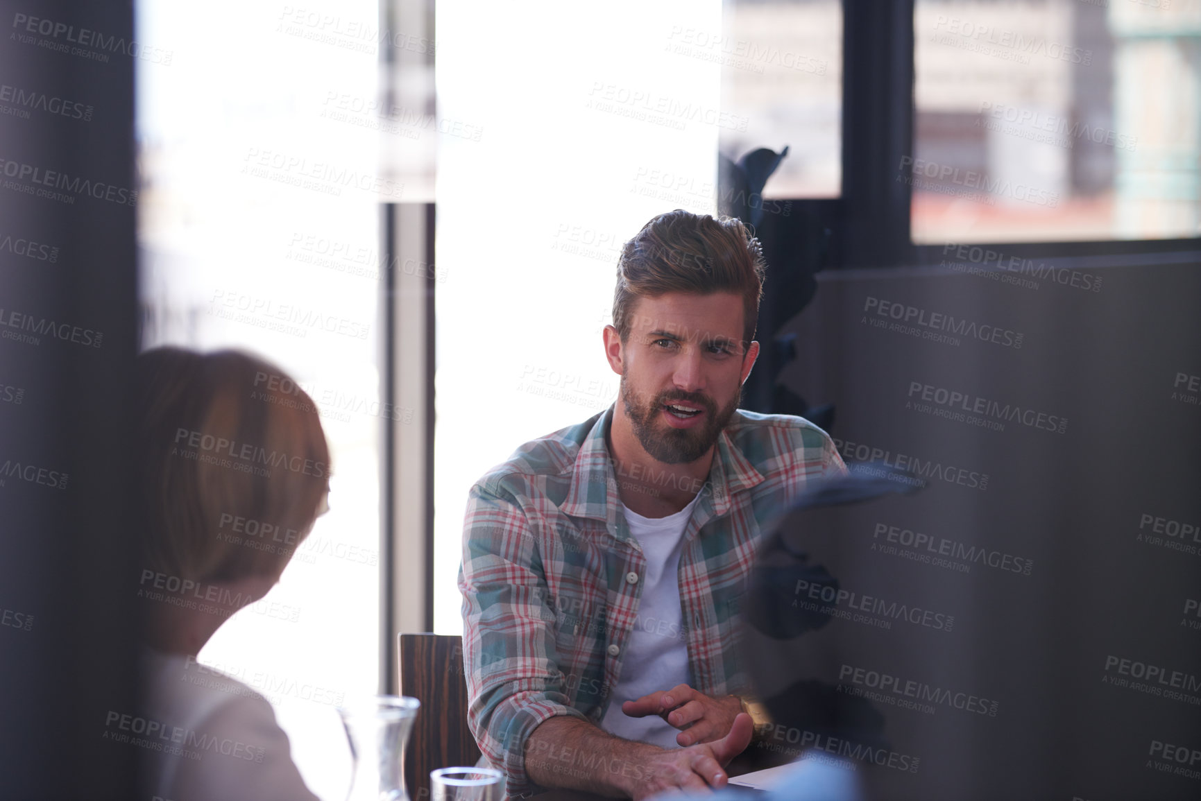 Buy stock photo A group of informal businesspeople in a meeting