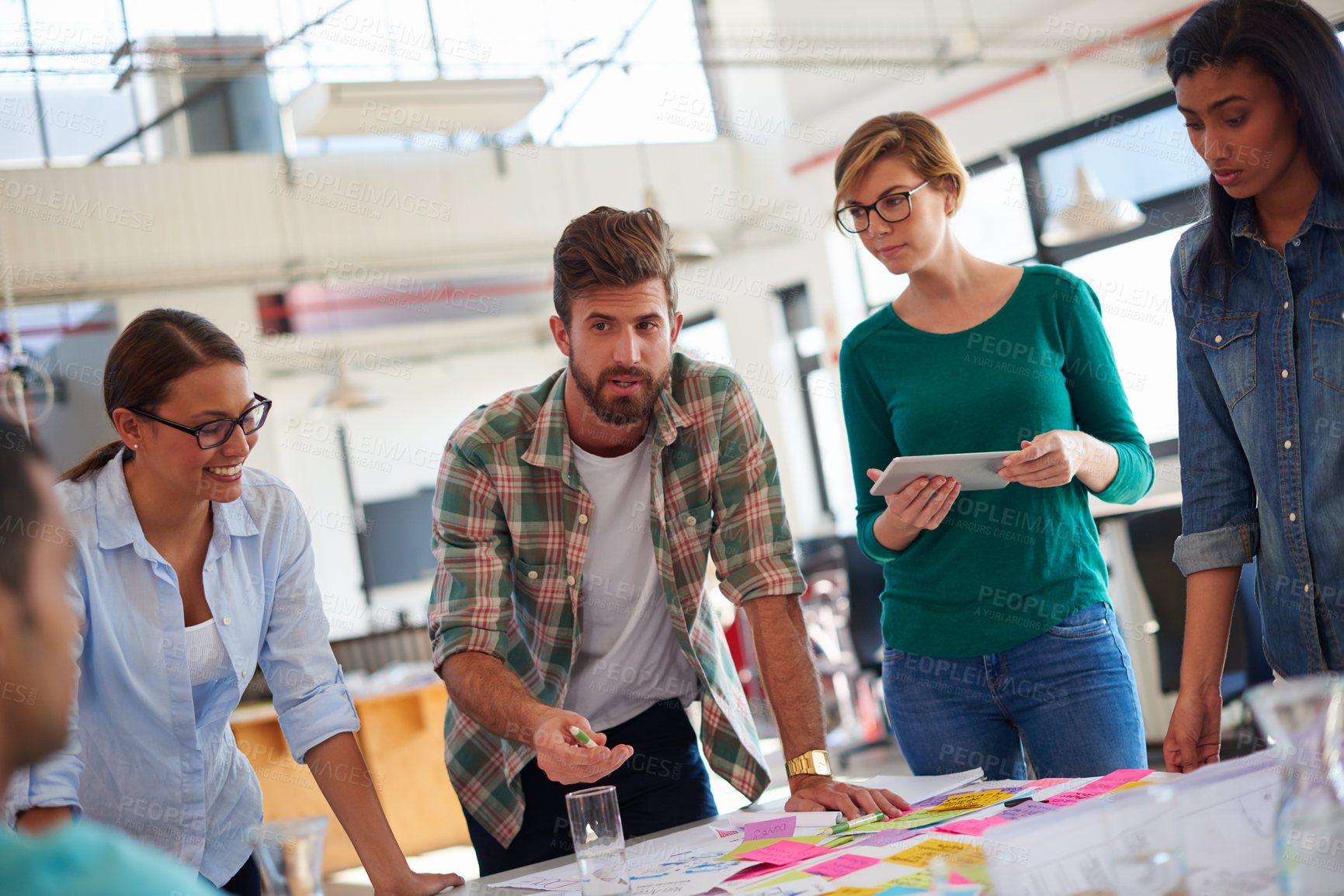 Buy stock photo A group of informal businesspeople in a meeting