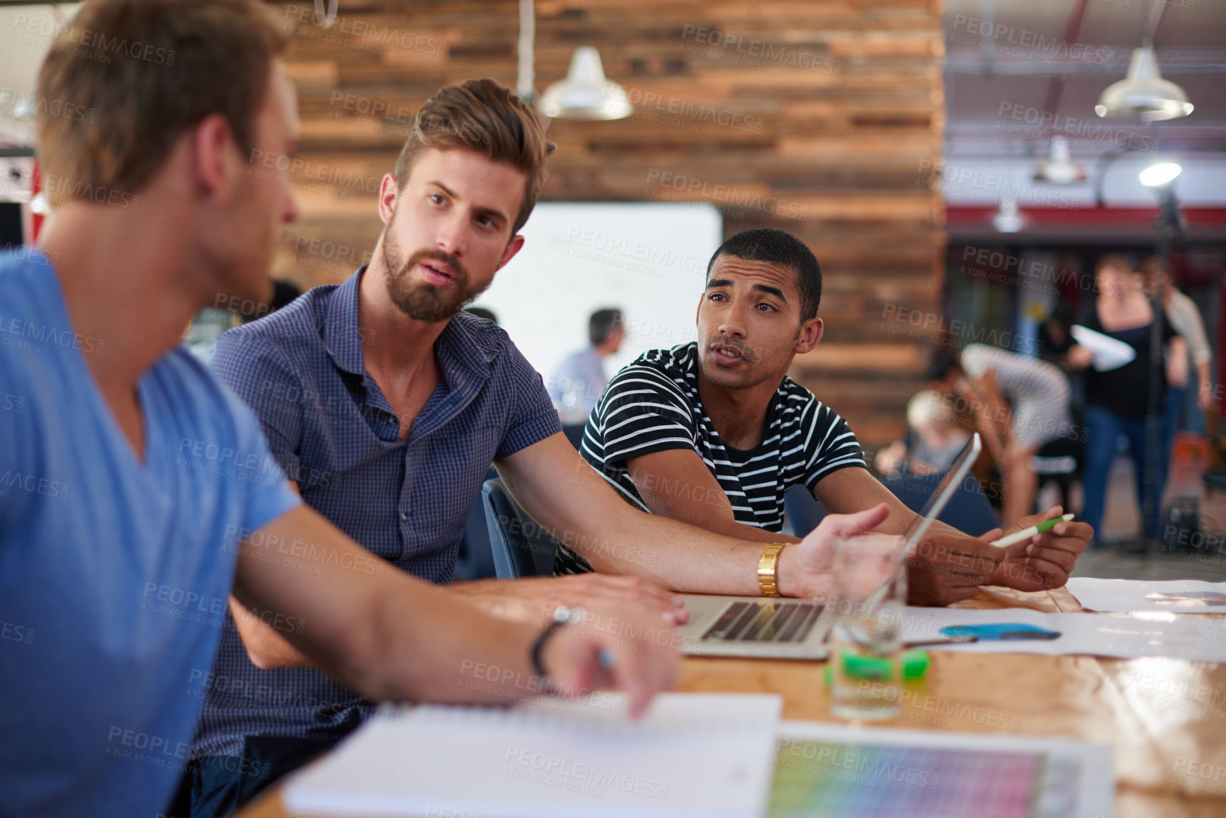 Buy stock photo A group of informal businesspeople in a meeting