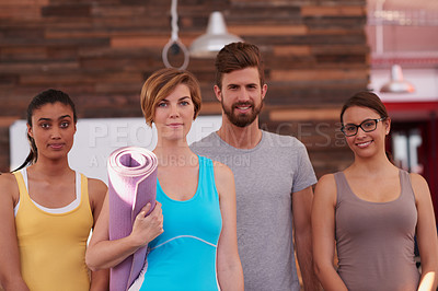 Buy stock photo Shot of a group of yoga enthuisiasts looking at the camera