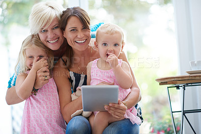 Buy stock photo Portrait, lesbian parents and tablet for children, adoption and happy with family home, bonding or relax. Female people, foster mom and tech in house, lounge or apartment on weekend as lgbt community