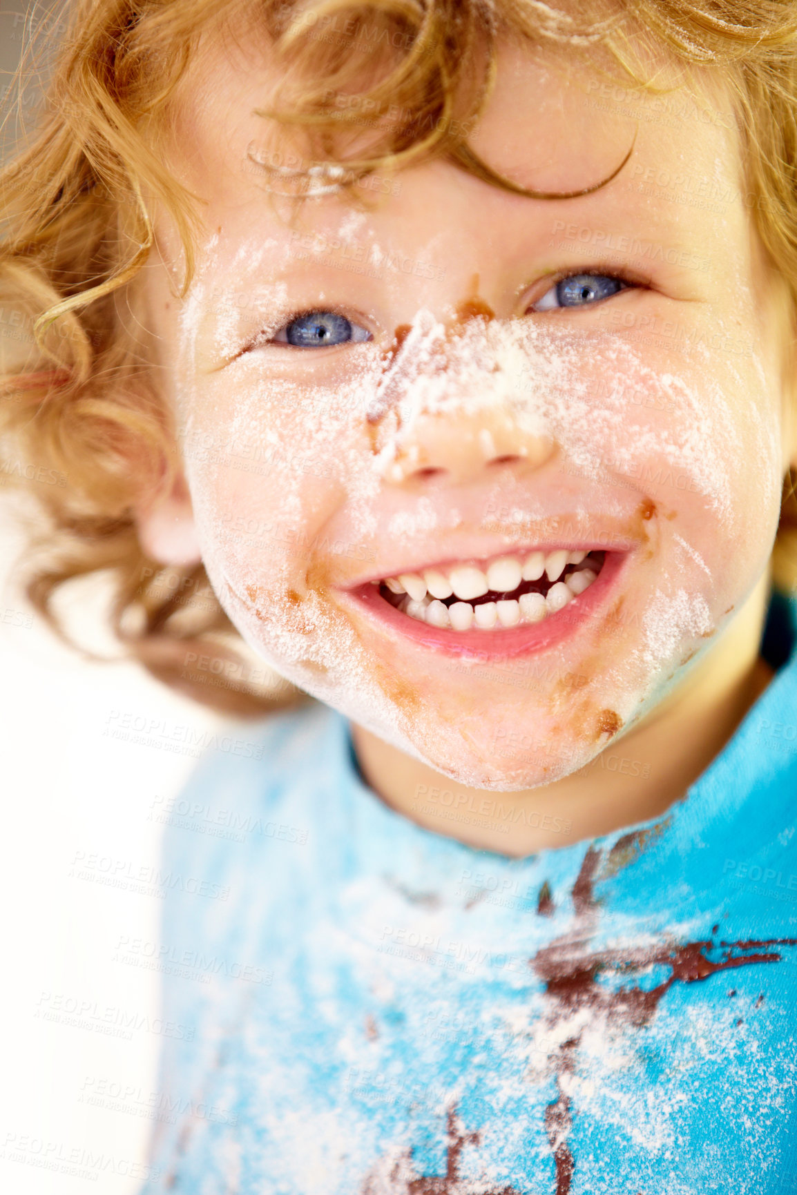 Buy stock photo Portrait, mess and flour with a boy in the kitchen of his home, learning how to cook for child development. Children, bake and a happy young kid looking naughty with food ingredients on his face