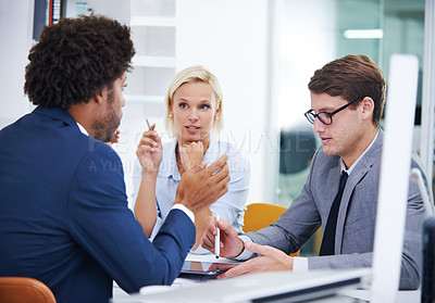 Buy stock photo Shot of a businesswoman making a point in an office meeting