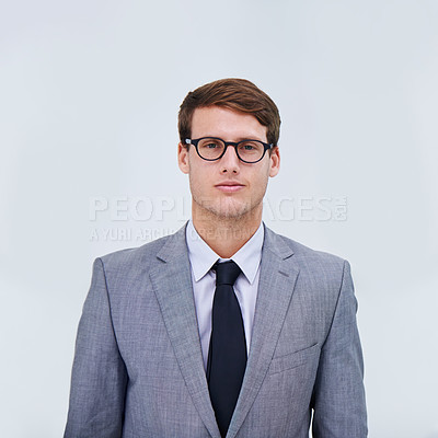 Buy stock photo Portrait of a confident businesman wearing spectacles against a white background