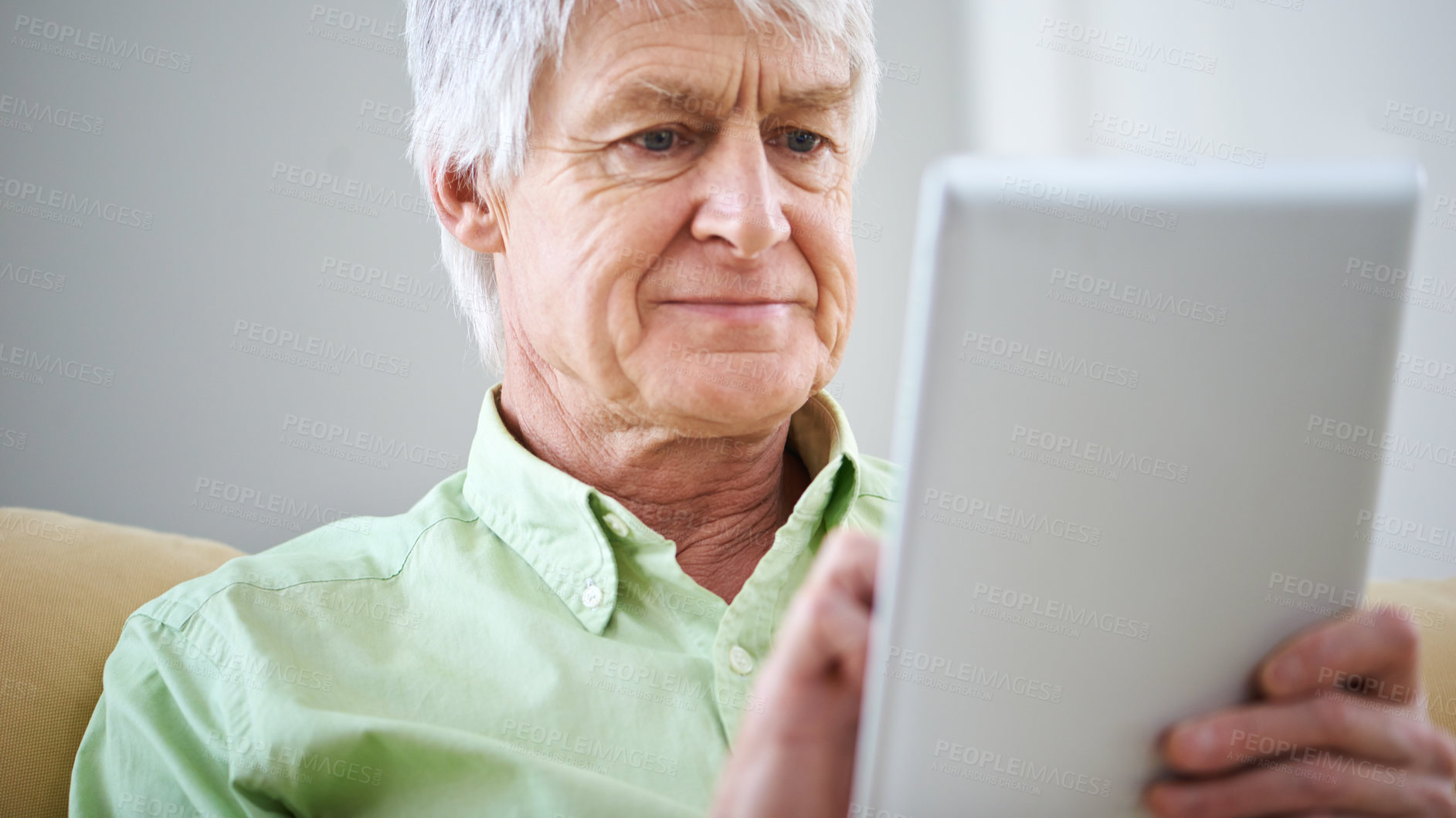 Buy stock photo Tablet, home and elderly man in home on internet for social media, website and online entertainment. Retirement, relax and senior person on digital tech for search, reading news and crossword