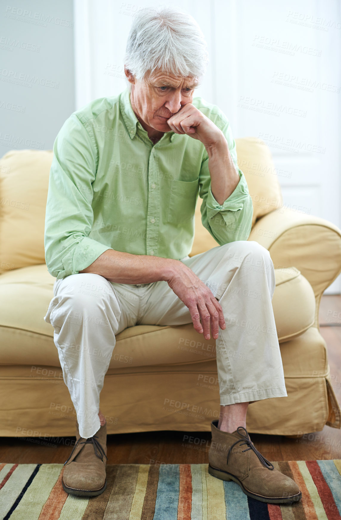 Buy stock photo Senior man, sad and memory on sofa for ideas, choice or thinking for perspective in nursing home. Elderly person, reflection and remember with nostalgia, wonder or insight for decision in living room