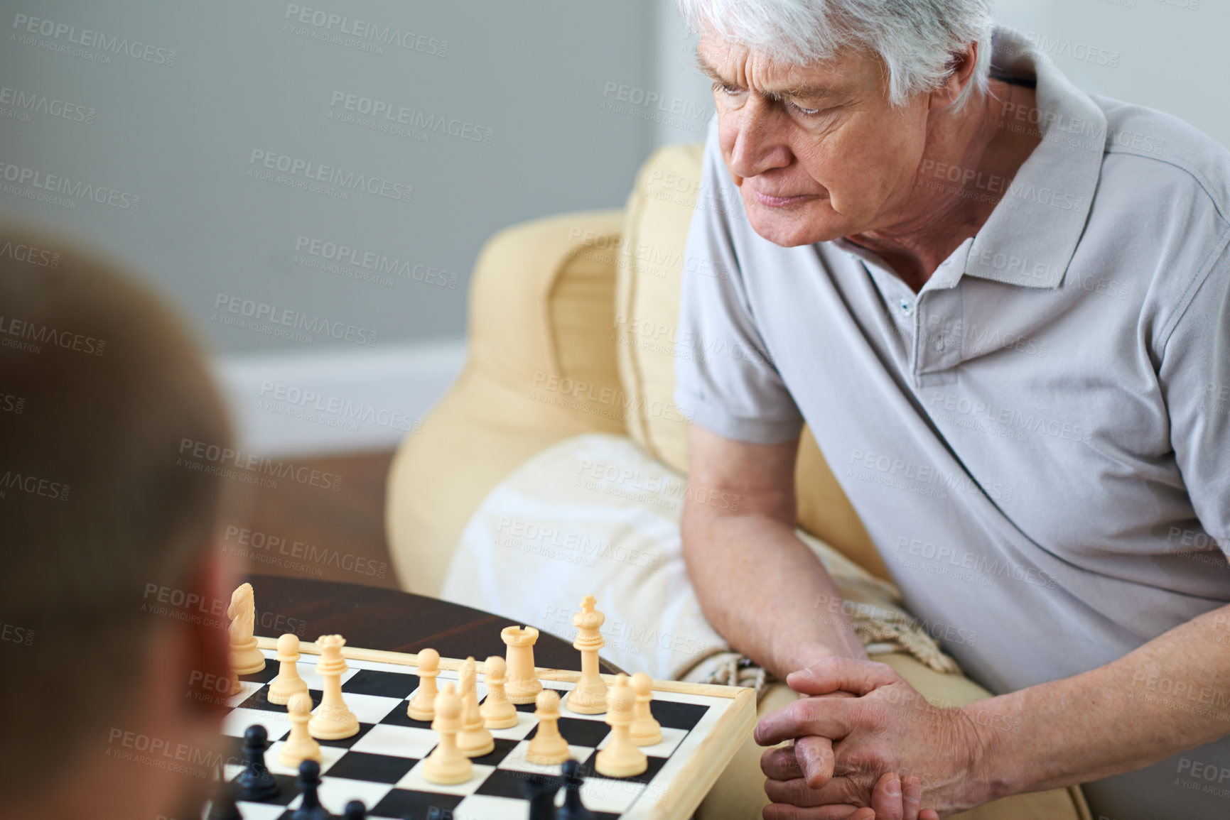 Buy stock photo Senior dad, thinking or chess challenge in home for games or competition with strategy or problem solving. Elderly father, contest or board for brain or learning mental skills for cognitive function