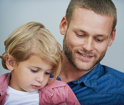 Buy stock photo Shot of a happy father spending quality time with his young son