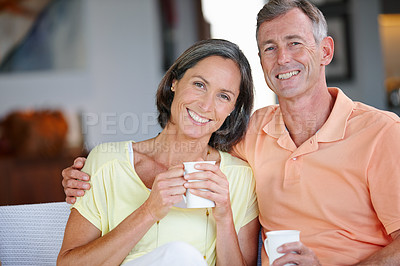 Buy stock photo Portrait of a  loving mature couple having coffee together at home