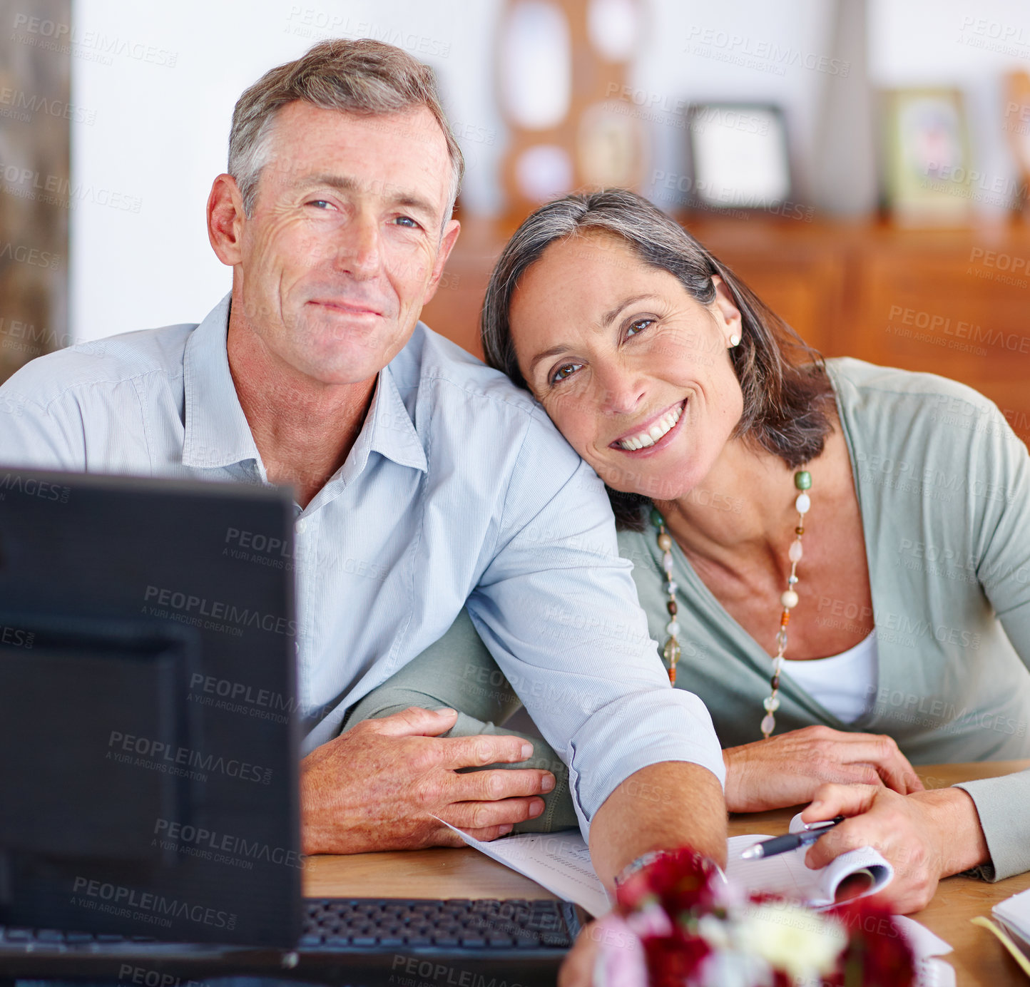 Buy stock photo Portrait of a mature married couple going through their finances at home