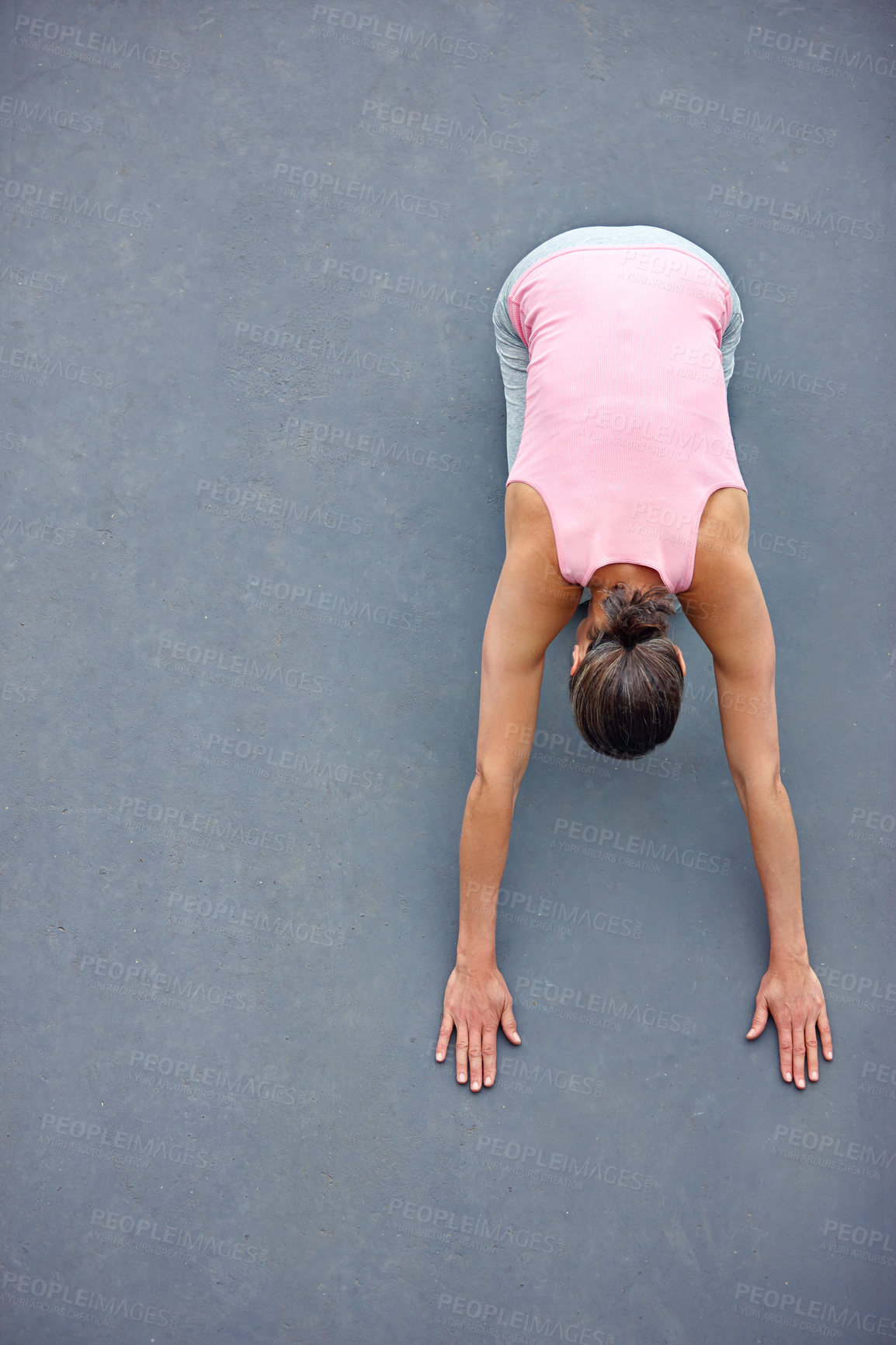 Buy stock photo High angle view of an attractive mature woman doing yoga outdoors