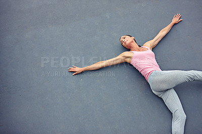 Buy stock photo High angle shot of an attractive mature woman doing yoga outdoors