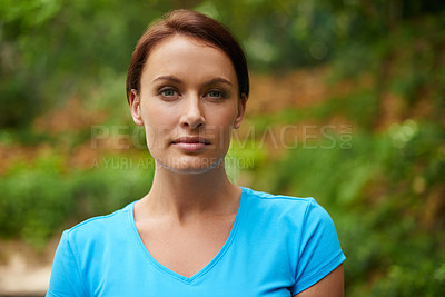 Buy stock photo Candid portrait of a beautiful young woman outdoors