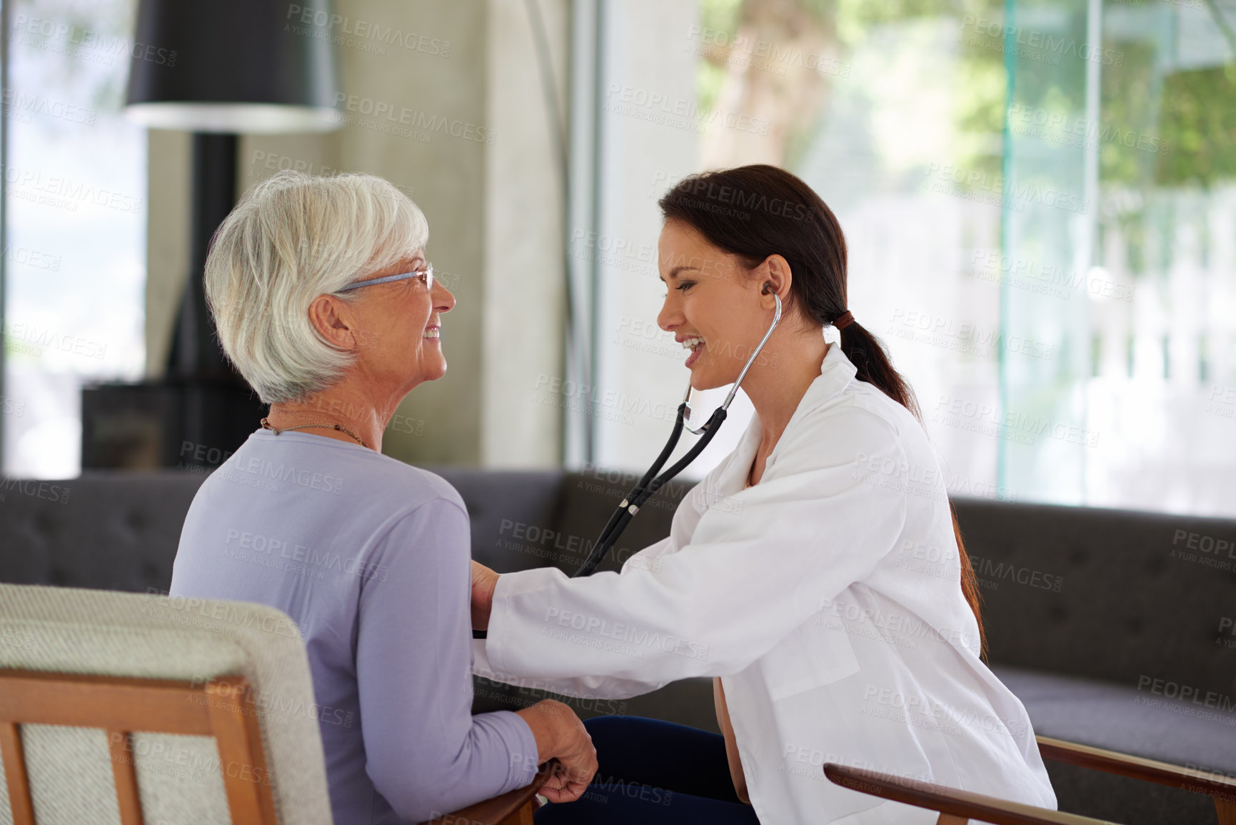 Buy stock photo Doctor, senior woman and stethoscope for medical assessment, check and happy for results. People, medic and elderly patient with help for breathing, lungs or cardiology in retirement at nursing home