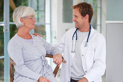 Buy stock photo Shot of a senior woman having a postiive talk with her doctor