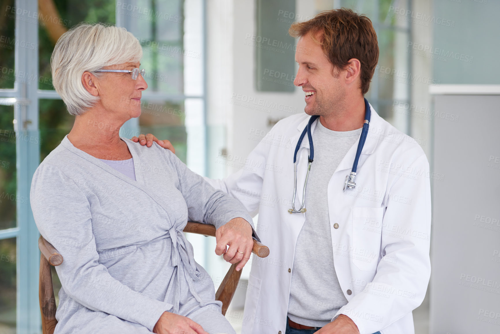 Buy stock photo Shot of a senior woman having a postiive talk with her doctor