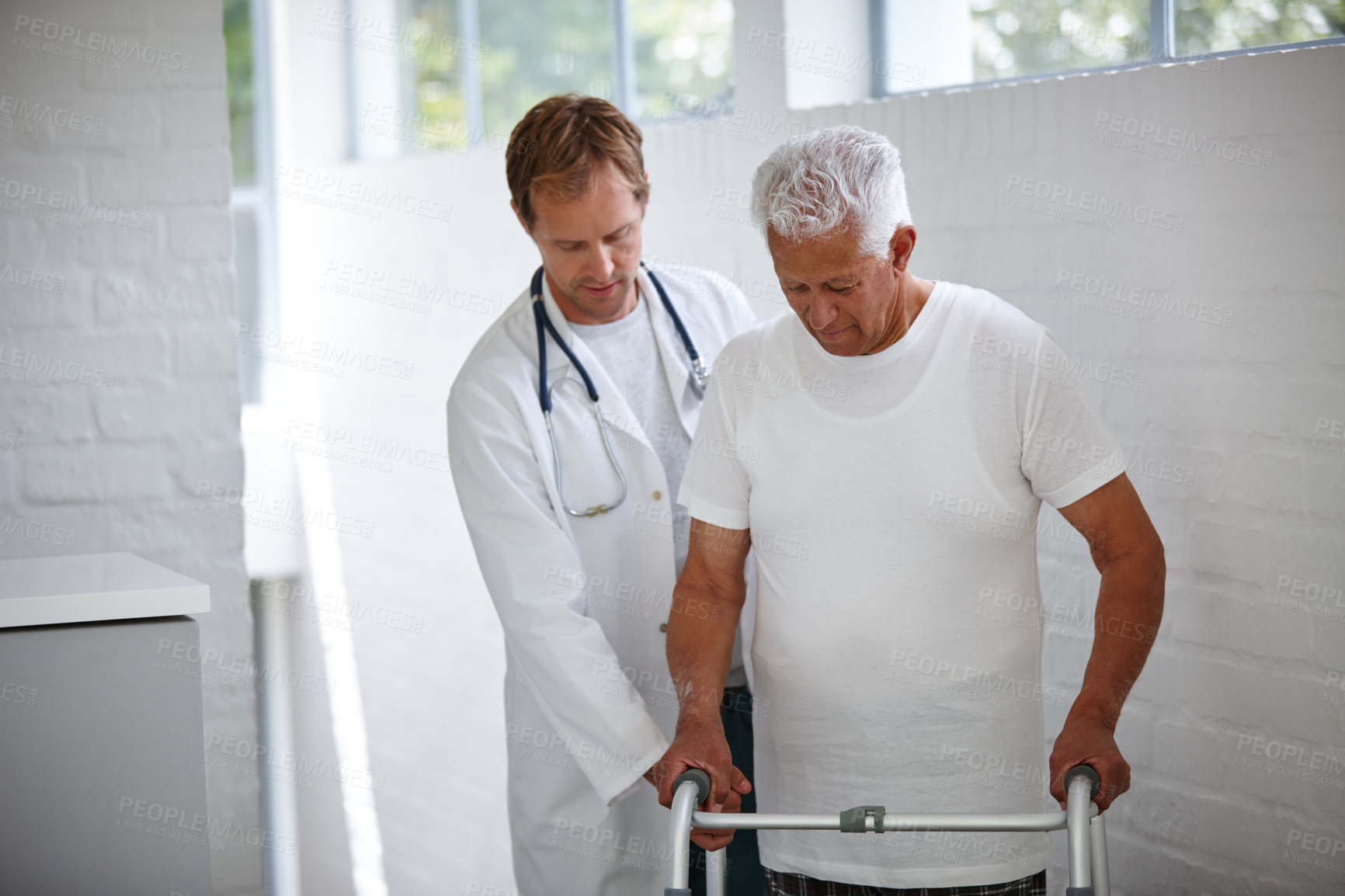 Buy stock photo Elderly man, doctor and helping with walker at house of medical support, healthcare and treatment. Therapist, mobility and patient with disability for exercise, physical therapy and rehabilitation
