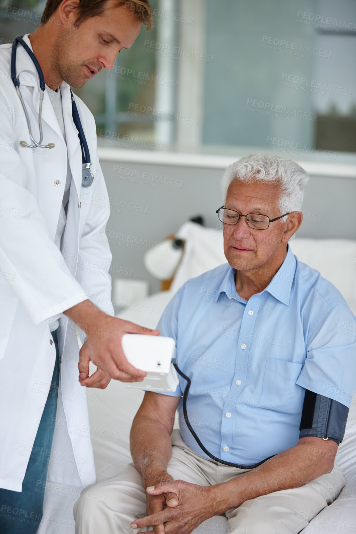 Buy stock photo Doctor, elderly man and blood pressure test for healthcare, check or results in bedroom. People, medic and senior patient with test for pulse, hypertension or cardiology in retirement at nursing home