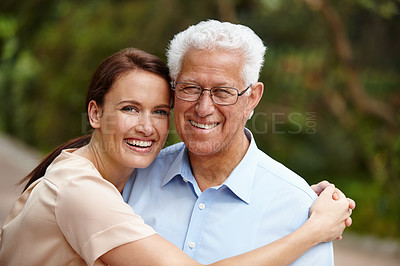 Buy stock photo Outdoor, senior father and daughter with happiness on portrait for bonding, support and care in France. Garden, family and hug parent with woman on visit at nursing home for wellness or retirement