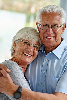 Buy stock photo Hug, portrait and senior couple in house with love, care and happy marriage in retirement together. Embrace, elderly man and old woman in home with smile, support and comfort with morning bonding.