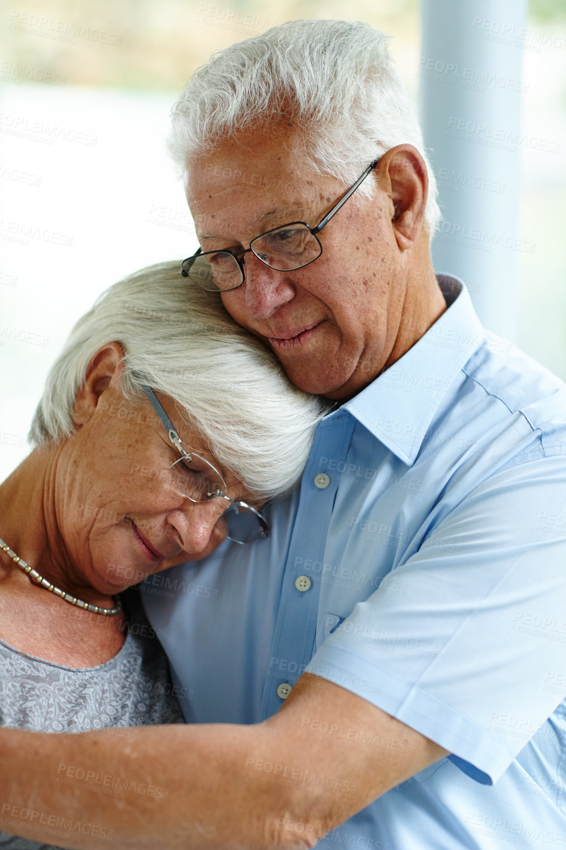 Buy stock photo Senior man, woman and hug for comfort in home with support, care and connection with love in retirement. Elderly people, couple and embrace for solidarity, empathy and loyalty with trust at apartment