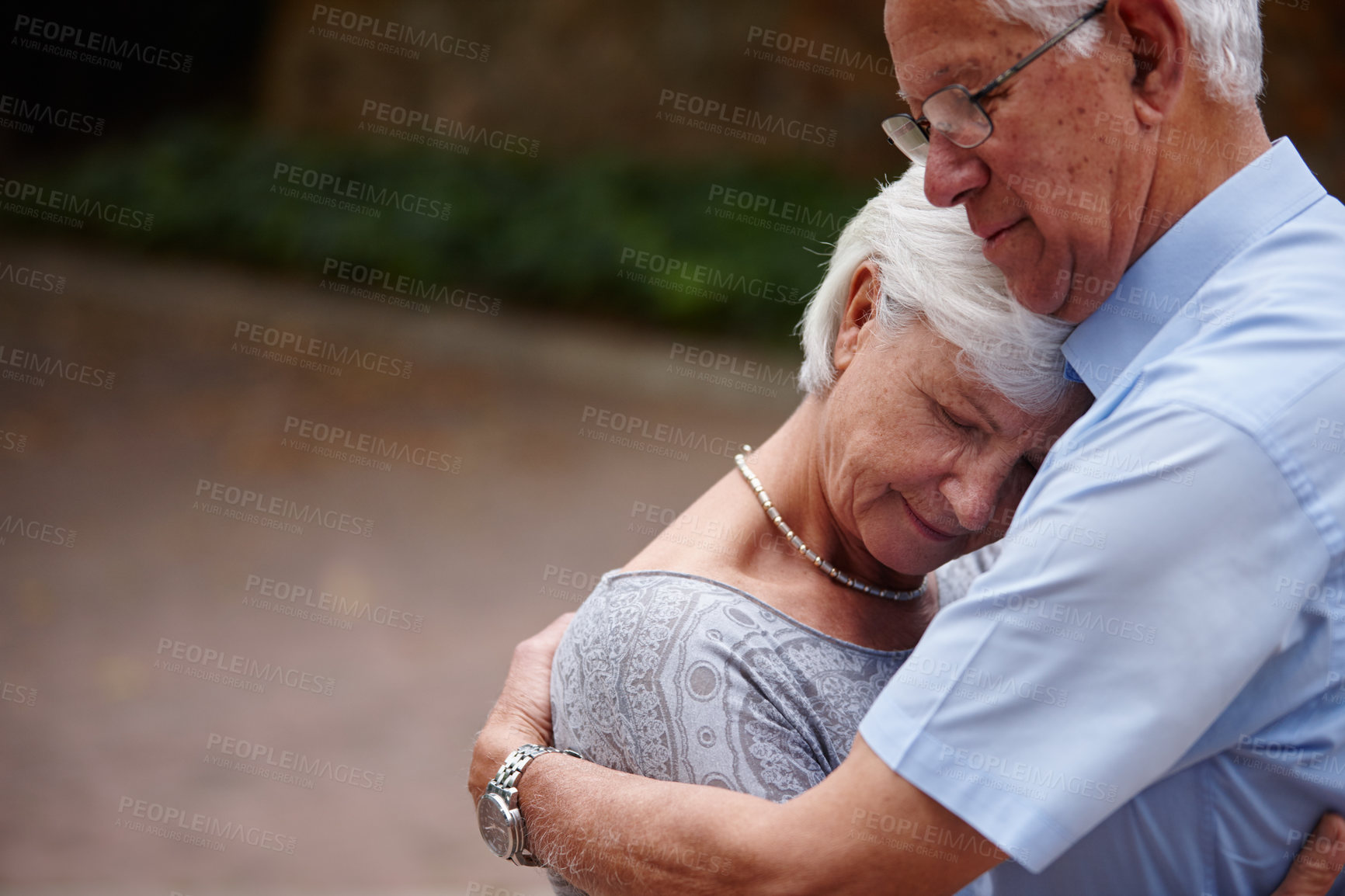 Buy stock photo Shot of a senior man consoling his wife