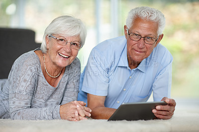 Buy stock photo Elderly couple, tablet and portrait in home for relax, online banking and memory app. Senior people, tech and happy in living room with connectivity, retirement research and communication in Canada