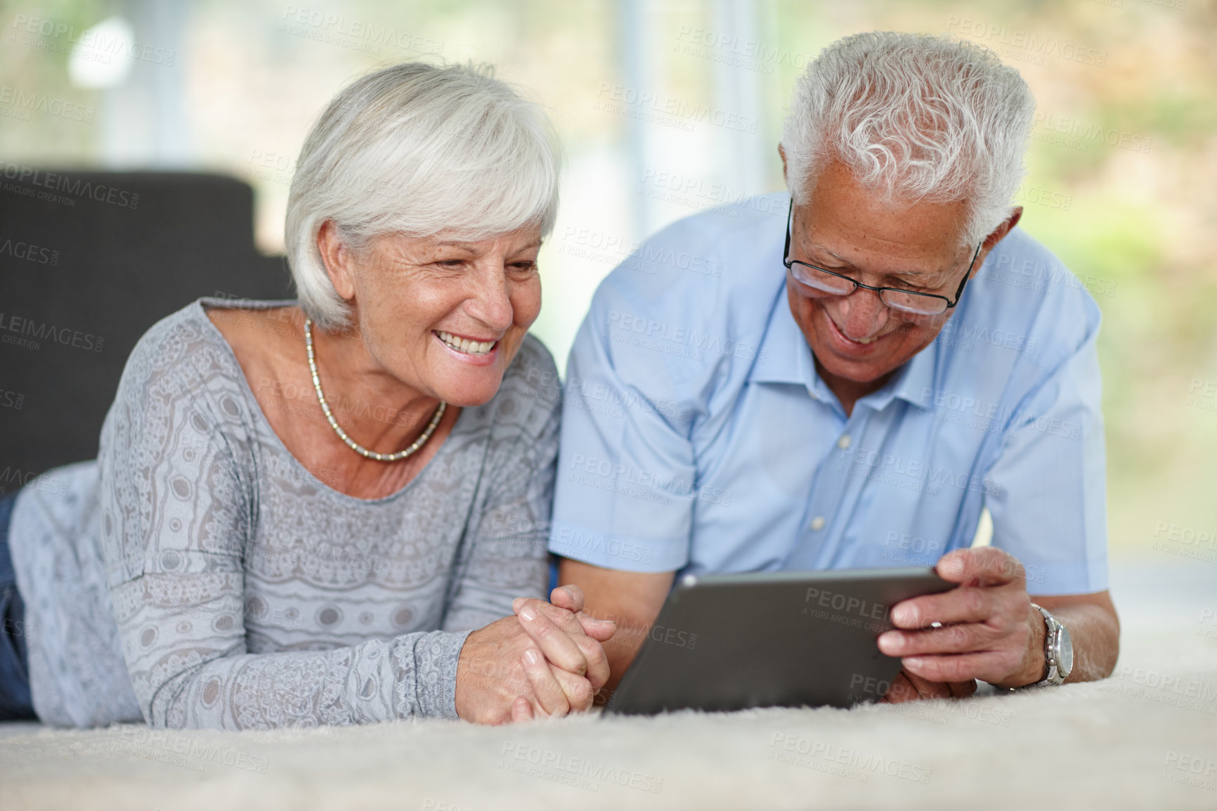 Buy stock photo Senior couple, tablet or relax in home for ebook, online banking or memory app. Elderly people, tech or scroll in living room with connectivity, retirement research and booking appointment on website