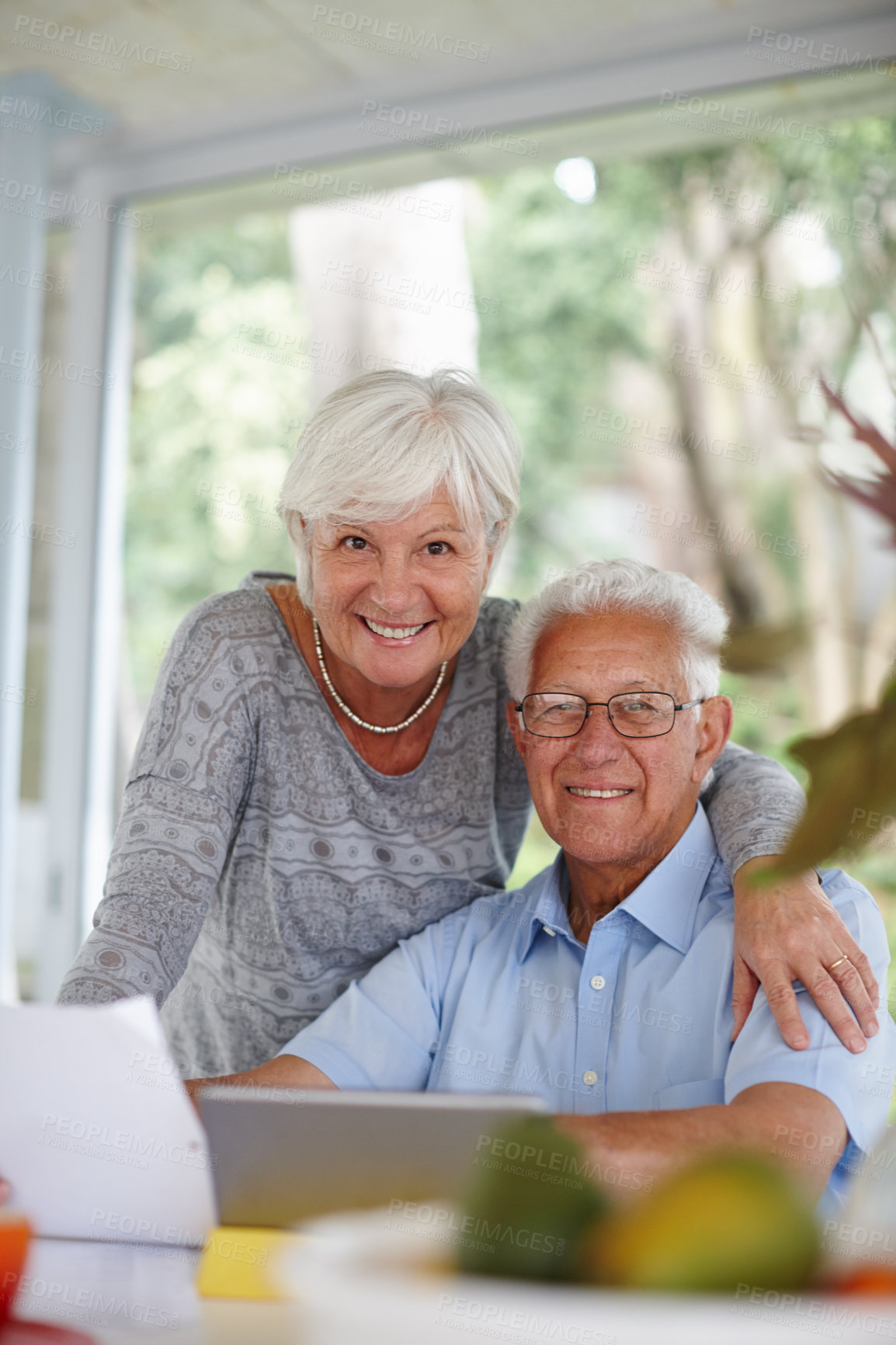 Buy stock photo Senior couple, tablet and documents for portrait with smile for profit, goal or investment growth in home. Elderly man, woman and paperwork with touchscreen, review or finance for retirement in Spain