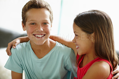 Buy stock photo Shot of a loving brother and sister at home