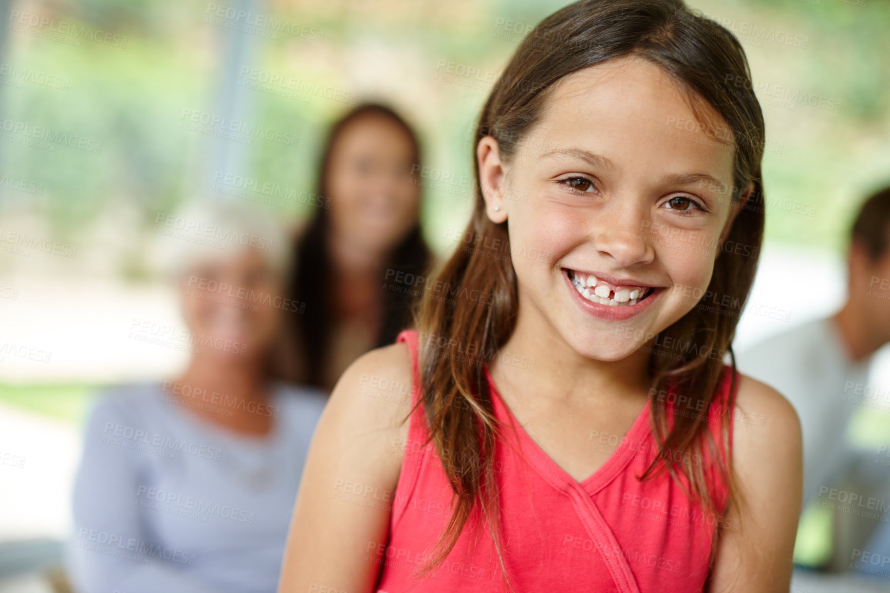 Buy stock photo Girl, confident or portrait of happy child in home for joy and fun with family in living room of house. Smile, growth or face of proud female kid for development, satisfaction or childhood in Spain