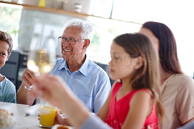 Buy stock photo Home, people and wine with food for dinner, brunch and generations for bonding together with celebration. House, family and happy with children for nutrition, meal and alcohol for toast in apartment