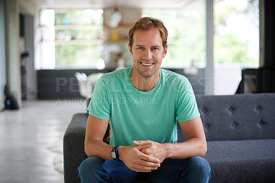 Buy stock photo Shot of a handsome young man at home