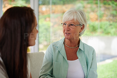 Buy stock photo An adult daughter and her mother spending time together