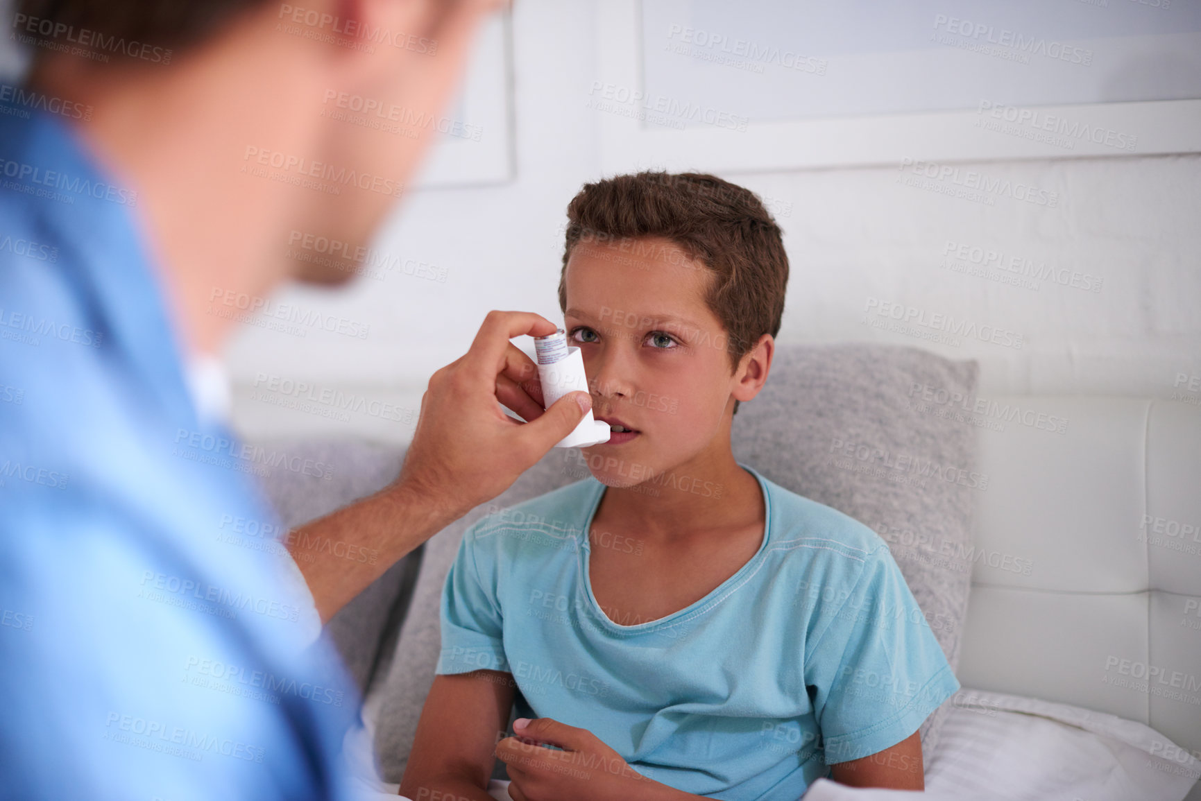 Buy stock photo Father, boy and bed with inhaler for asthma, chronic disease or breathing air at home. Dad, son or sick child with pump for medicine, medication or treatment for allergy, virus or blocked airways