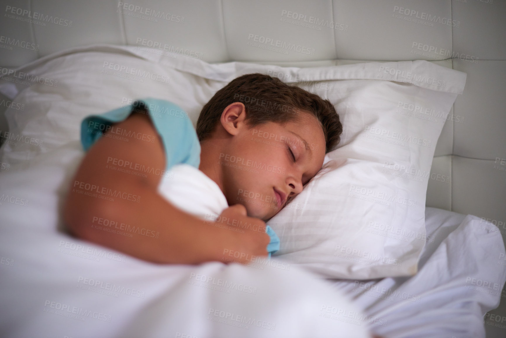 Buy stock photo A little boy asleep in his bed