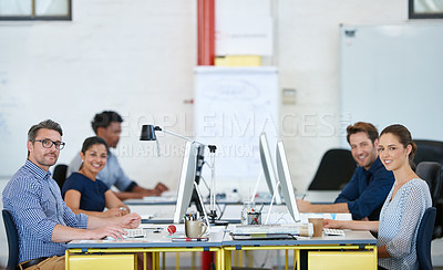 Buy stock photo Portrait of a group of designers working at their computers in an office