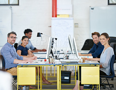 Buy stock photo Portrait of a group of designers working at their computers in an office