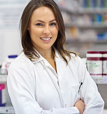 Buy stock photo Portrait of an attractive young pharmacist at work