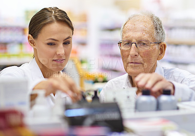 Buy stock photo Pharmacy, customer and people with support by shelf for medication, information and medical advice. Pharmacist, drugs and elderly man with choice of pills for healthcare, treatment and instructions