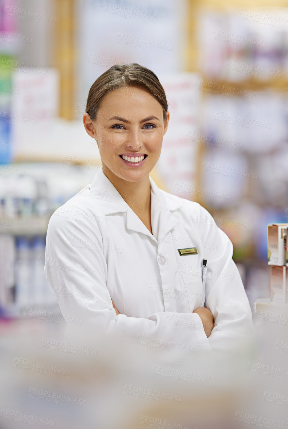 Buy stock photo Portrait of an attractive young pharmacist at work