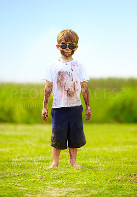 Buy stock photo Child, boy or mud on face with goggles in garden, grass or field for playing, fun and summer weather. Kid, person or eyewear covered in dirt on lawn or backyard for muddy play, childhood or enjoyment