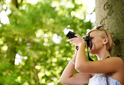 Buy stock photo Woman, photographer and shooting in nature with trees, camera and memory of environment mockup. Spring, park and freelancer filming forest outdoor on summer holiday, trip or travel with technology