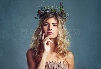 Buy stock photo Portrait, beauty and confident woman with flower crown for skin at studio isolated on a blue background mockup. Face, wreath and hairstyle of serious person in organic makeup, natural and thinking