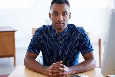 Buy stock photo Business, portrait and confident black man at desk in workplace, office or startup company for job of employee. Face, table and serious entrepreneur, creative and designer working in South Africa